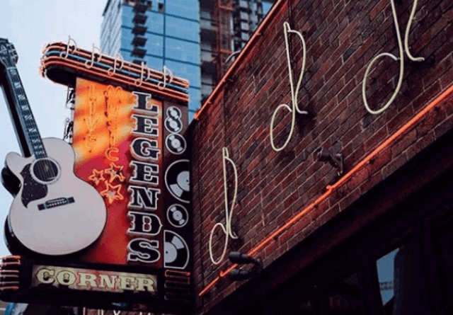 A photo of a stylish bar with guitar-themed branding
